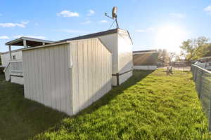 Exterior utility shed with vertical siding