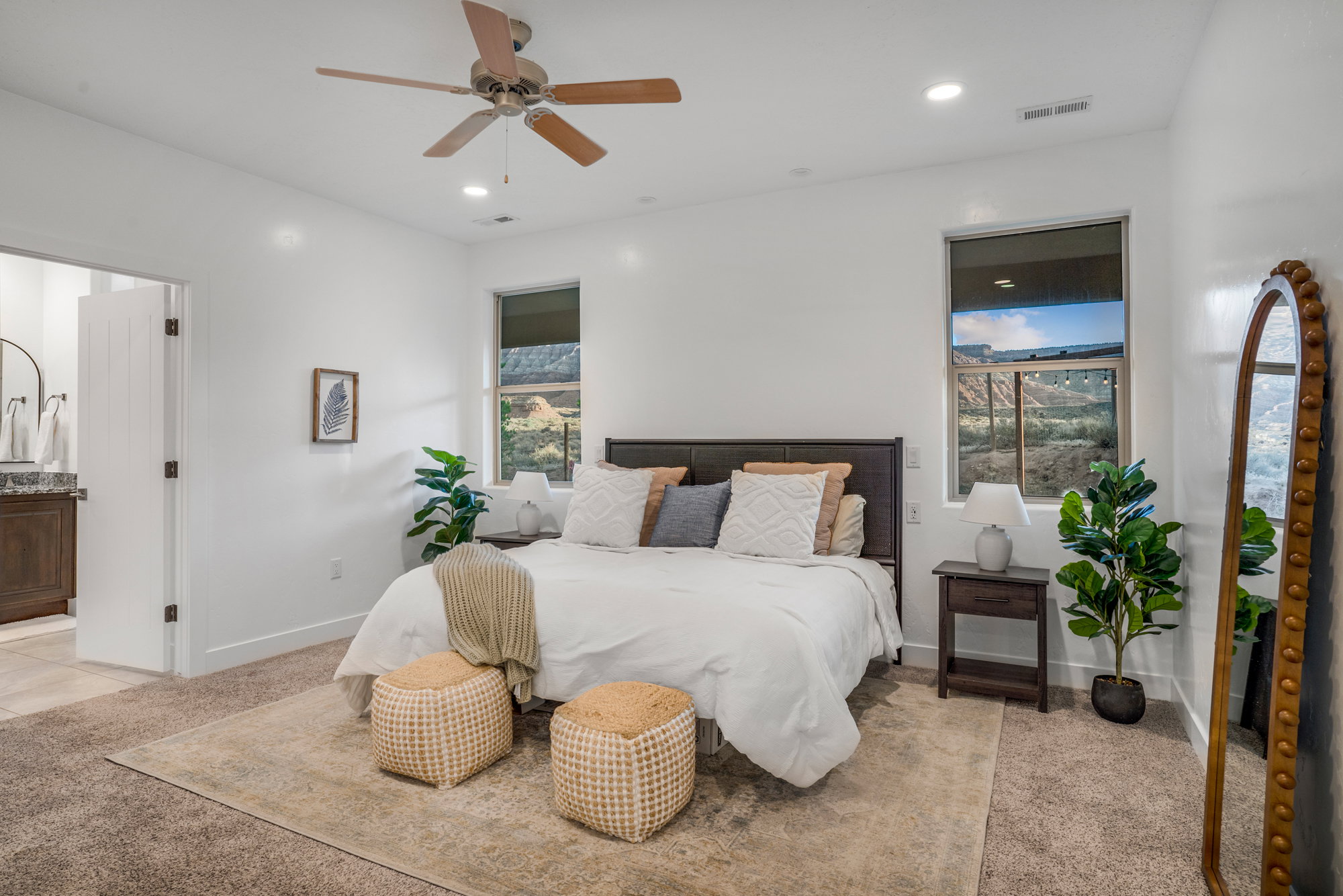 Spacious bedroom featuring recessed lighting and a ceiling fan