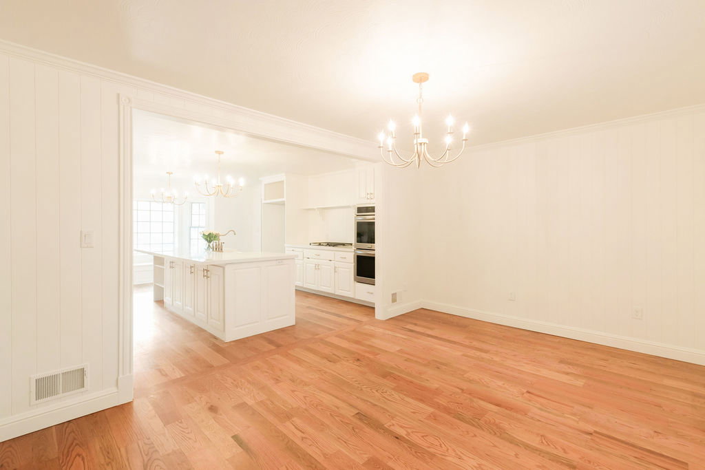 Hardwood flooring extends throughout this open layout