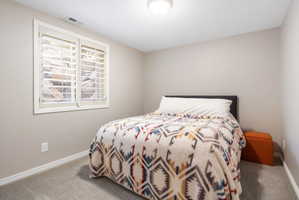 Recessed window featuring white plantation shutters