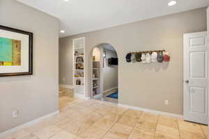 Travertine tile flooring complemented by light neutral wall tones