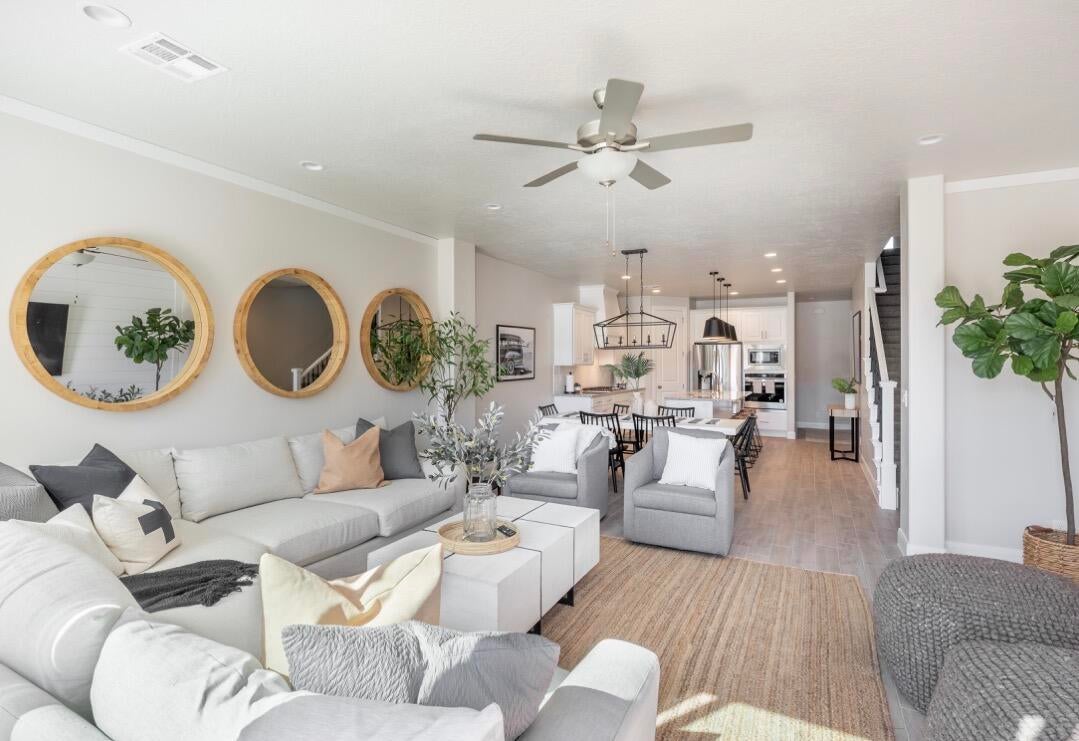 Open-concept living space featuring recessed lighting and wood-finish flooring