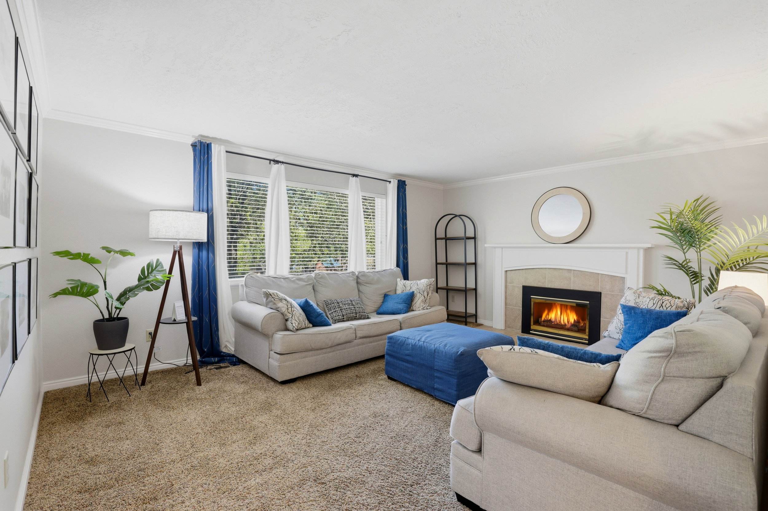 Living area featuring light-toned carpeting and neutral wall tones