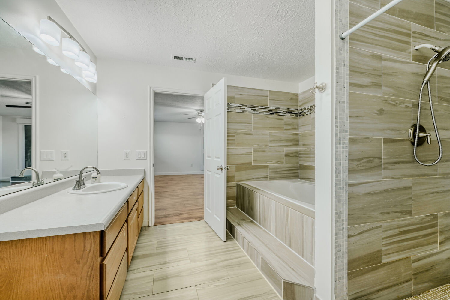 Master Bathroom with a walk in shower and a large soaking tub