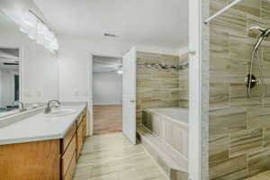 Master Bathroom with a walk in shower and a large soaking tub