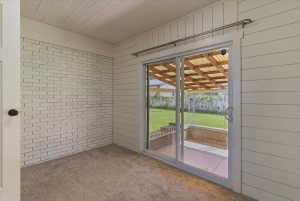 Sliding glass door opening to an outdoor patio