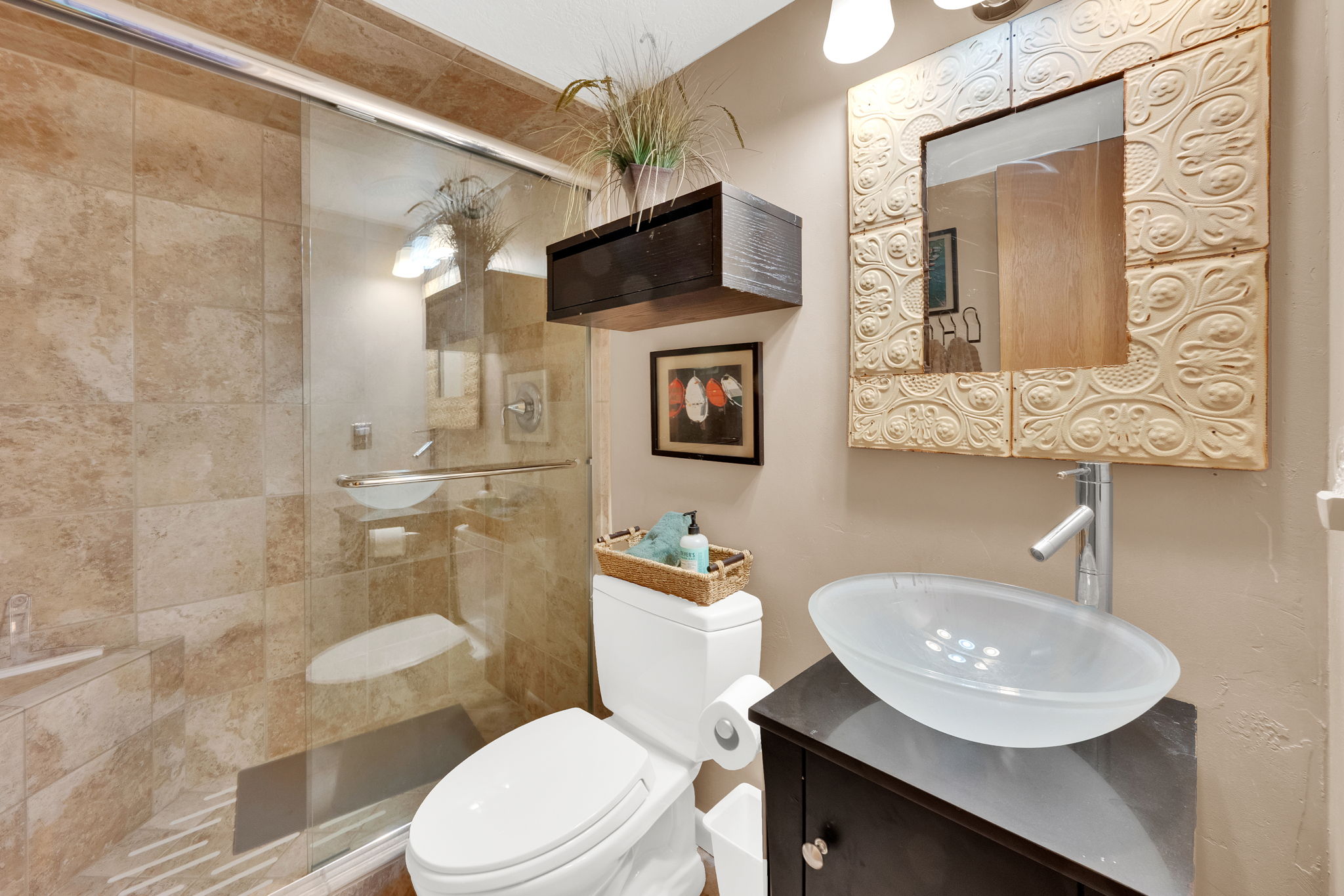 Glass-enclosed shower featuring large format tile