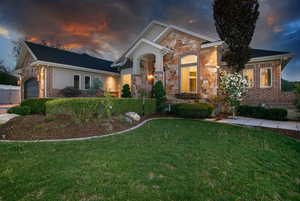 Exterior facade featuring a combination of brick and stone accents