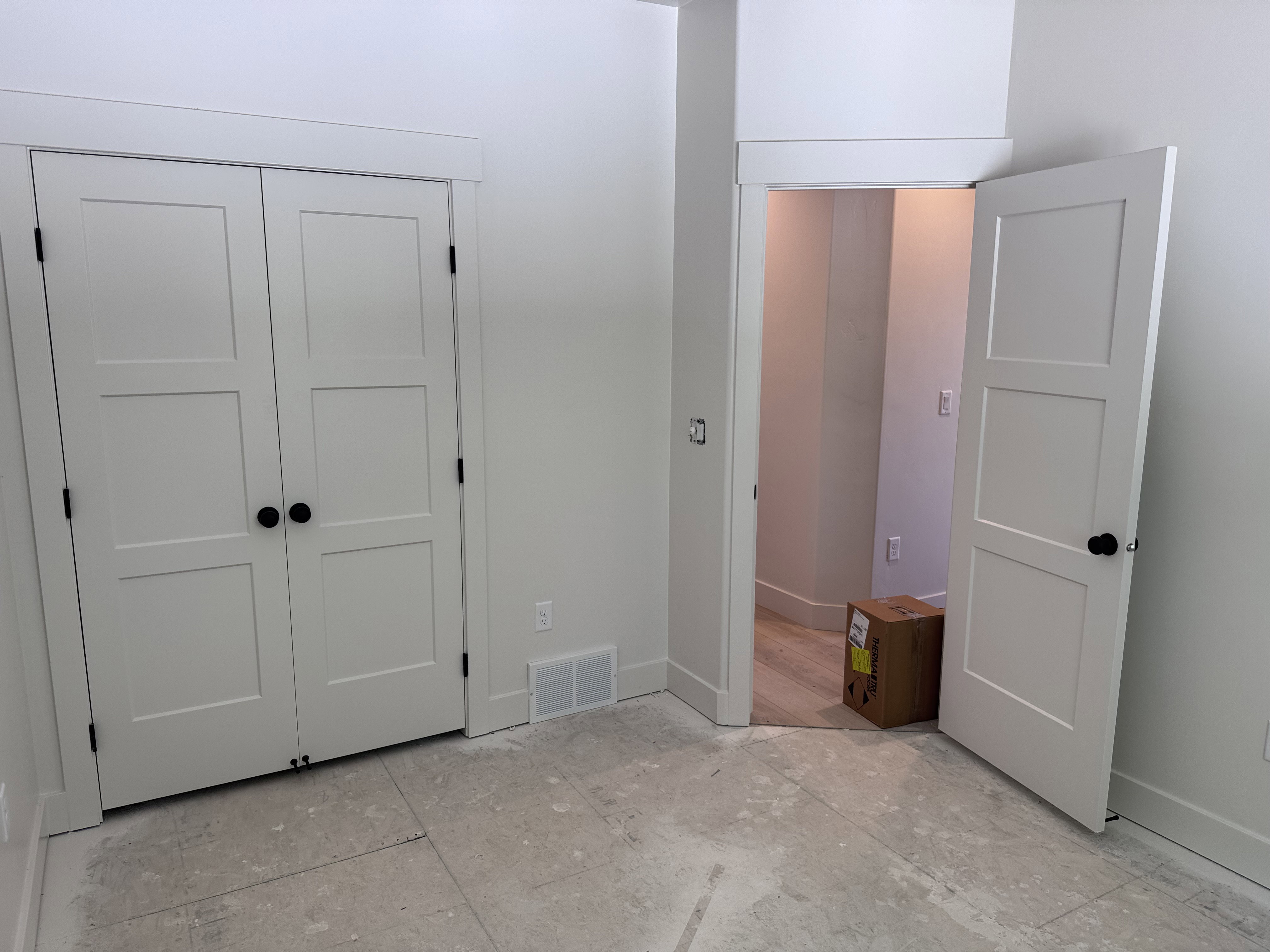 Neutral wall paint complemented by white trim and baseboards