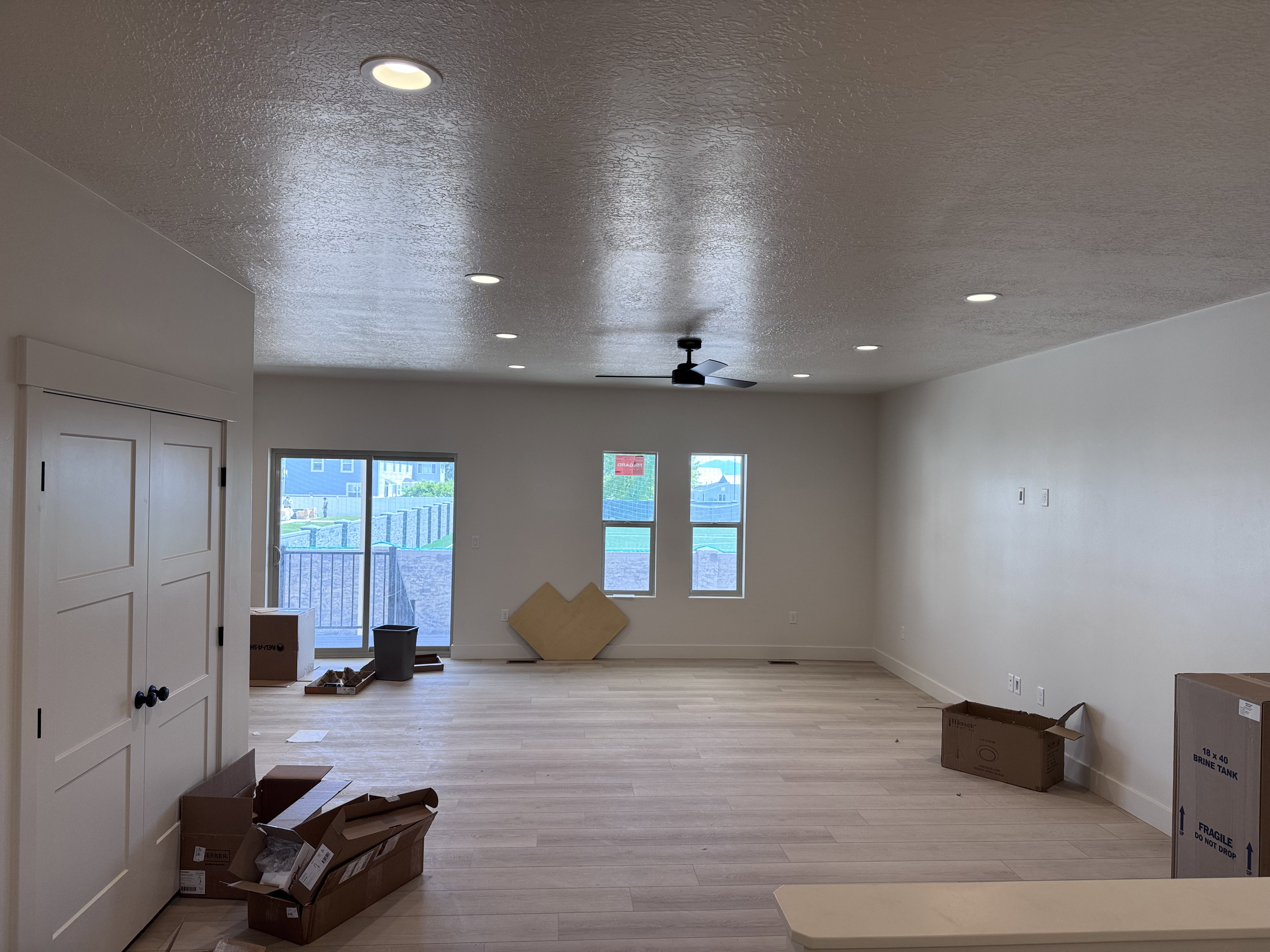 Spacious interior featuring wood-finish flooring and recessed lighting
