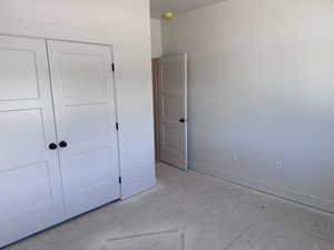 Room featuring neutral-toned walls, white trim, and light-colored flooring