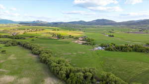 Expansive green landscape with distant mountains