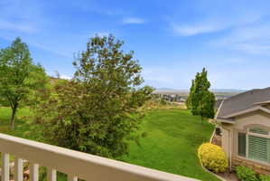 Expansive green lawn with established trees and surrounding landscaping