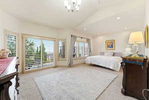 Spacious room with vaulted ceilings and recessed lighting