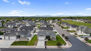 Expansive residential neighborhood featuring a variety of single-family homes with pitched roofs