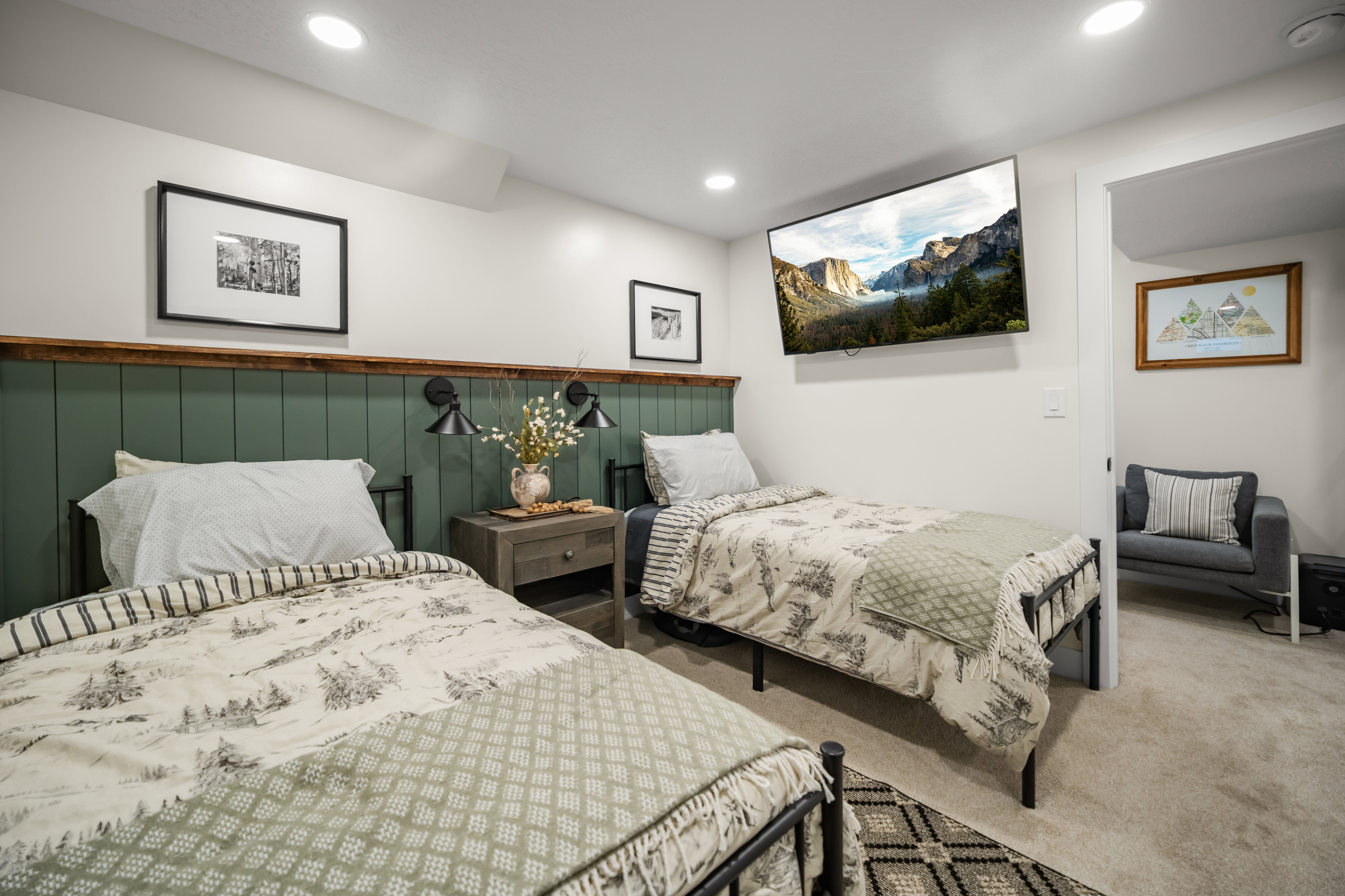 Room featuring carpet flooring, recessed lighting, and a wall-mounted television