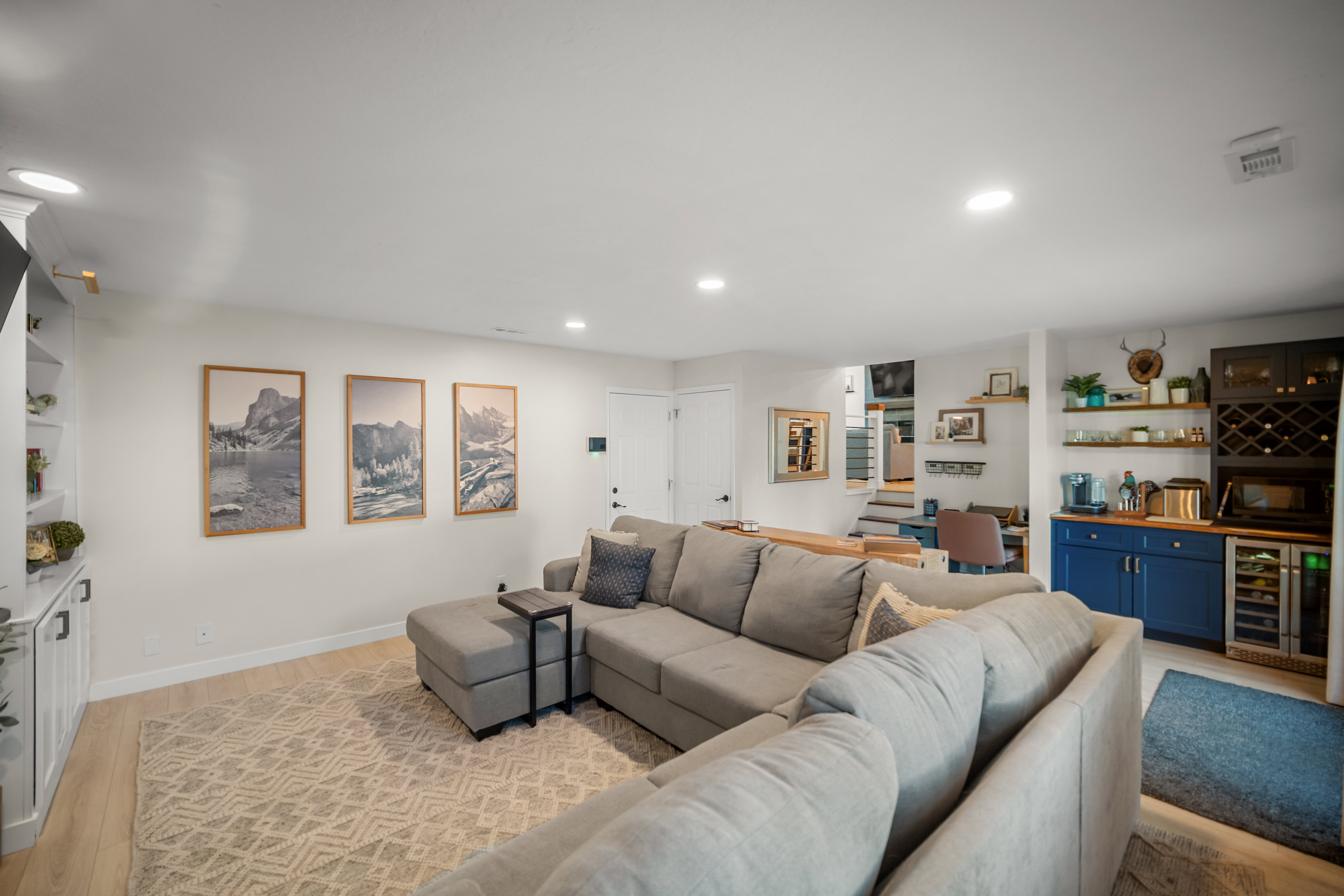 Open-concept living area featuring light wood-finish flooring