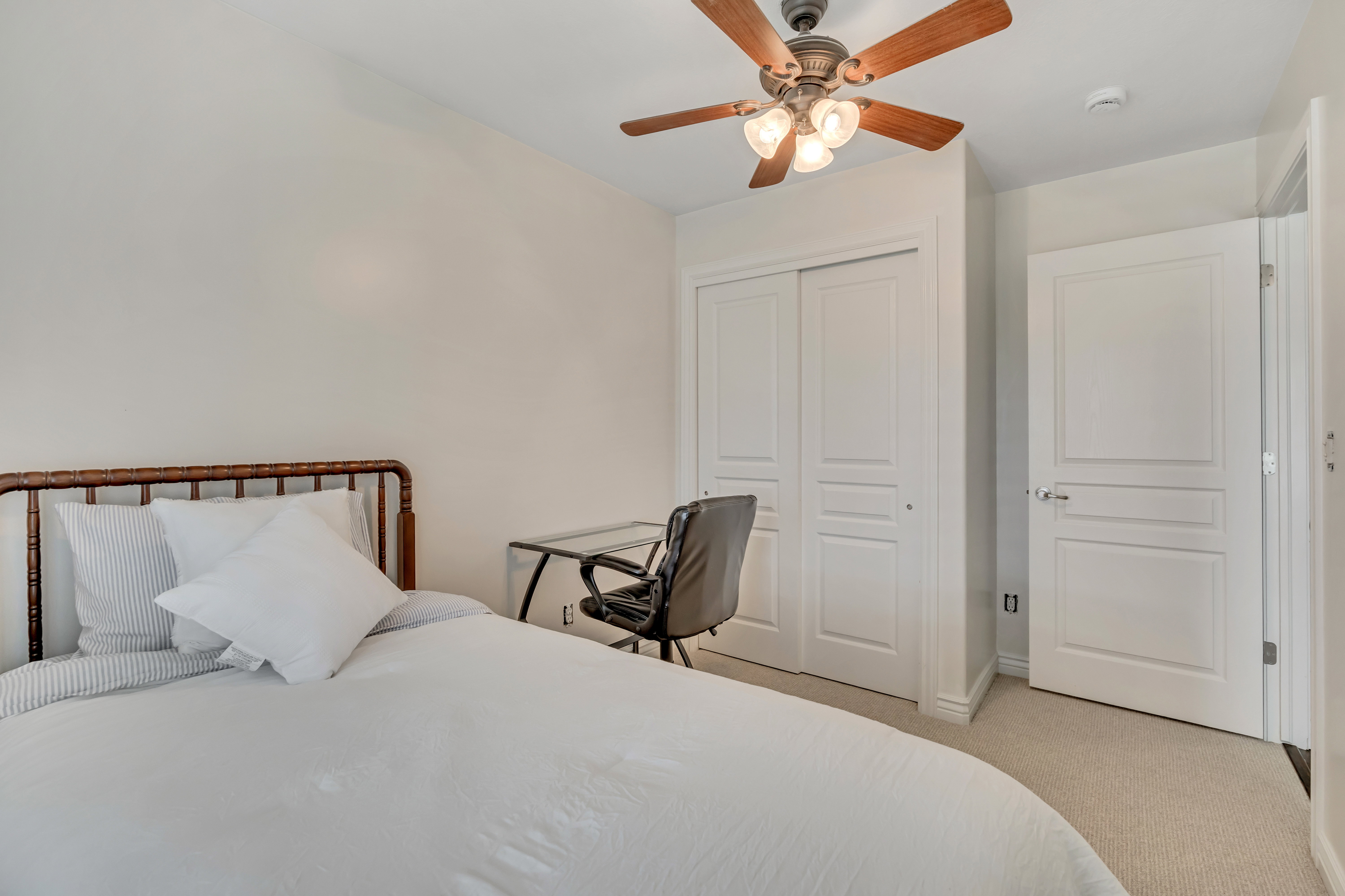 4th Upper Level Bedroom featuring neutral carpeting and white painted walls