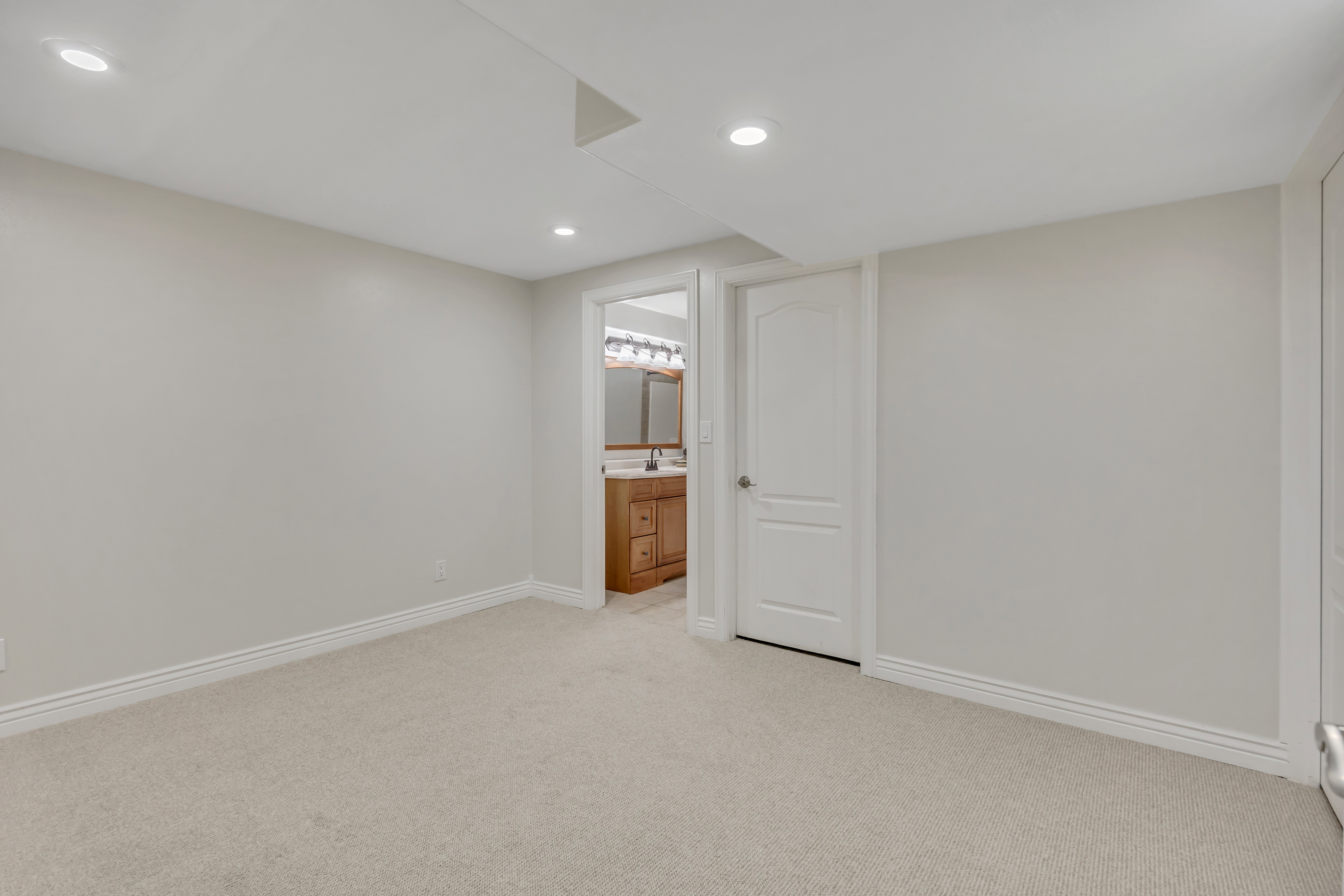 Carpeted room featuring recessed lighting, light gray wall paint, and white trim molding