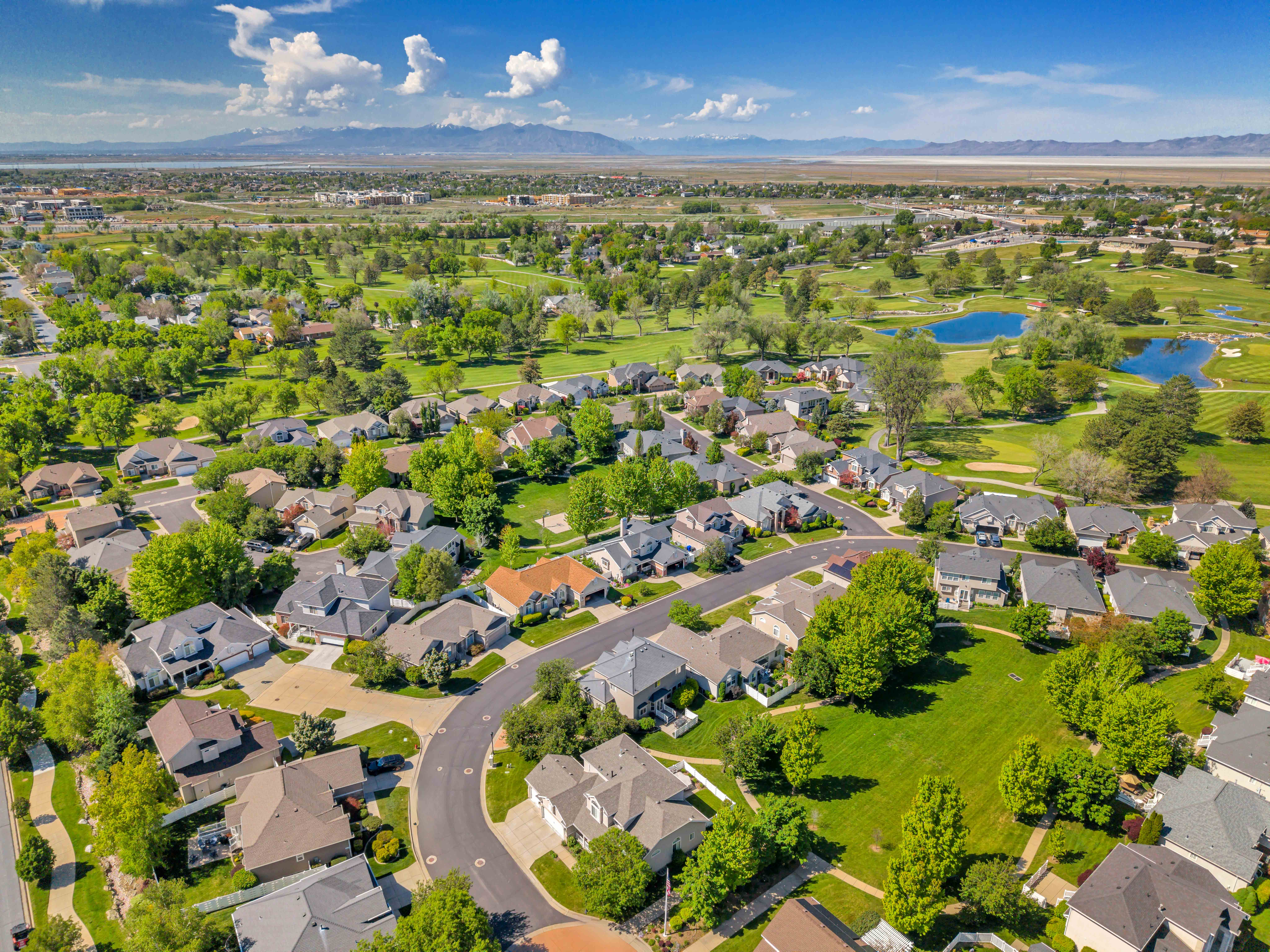 Aerial perspective showcasing a residential community with abundant green spaces