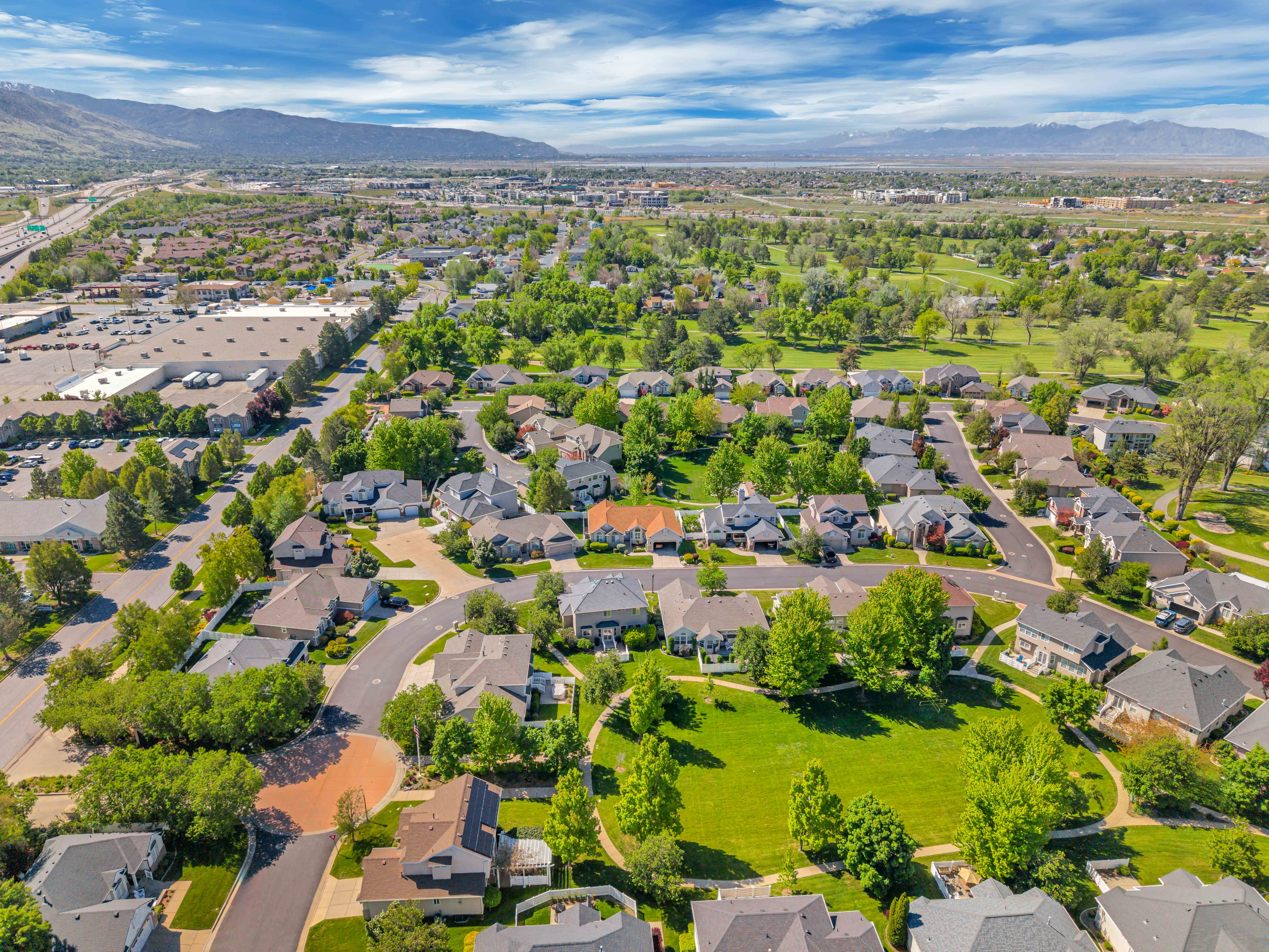 Aerial perspective showcasing a residential community with mature landscaping