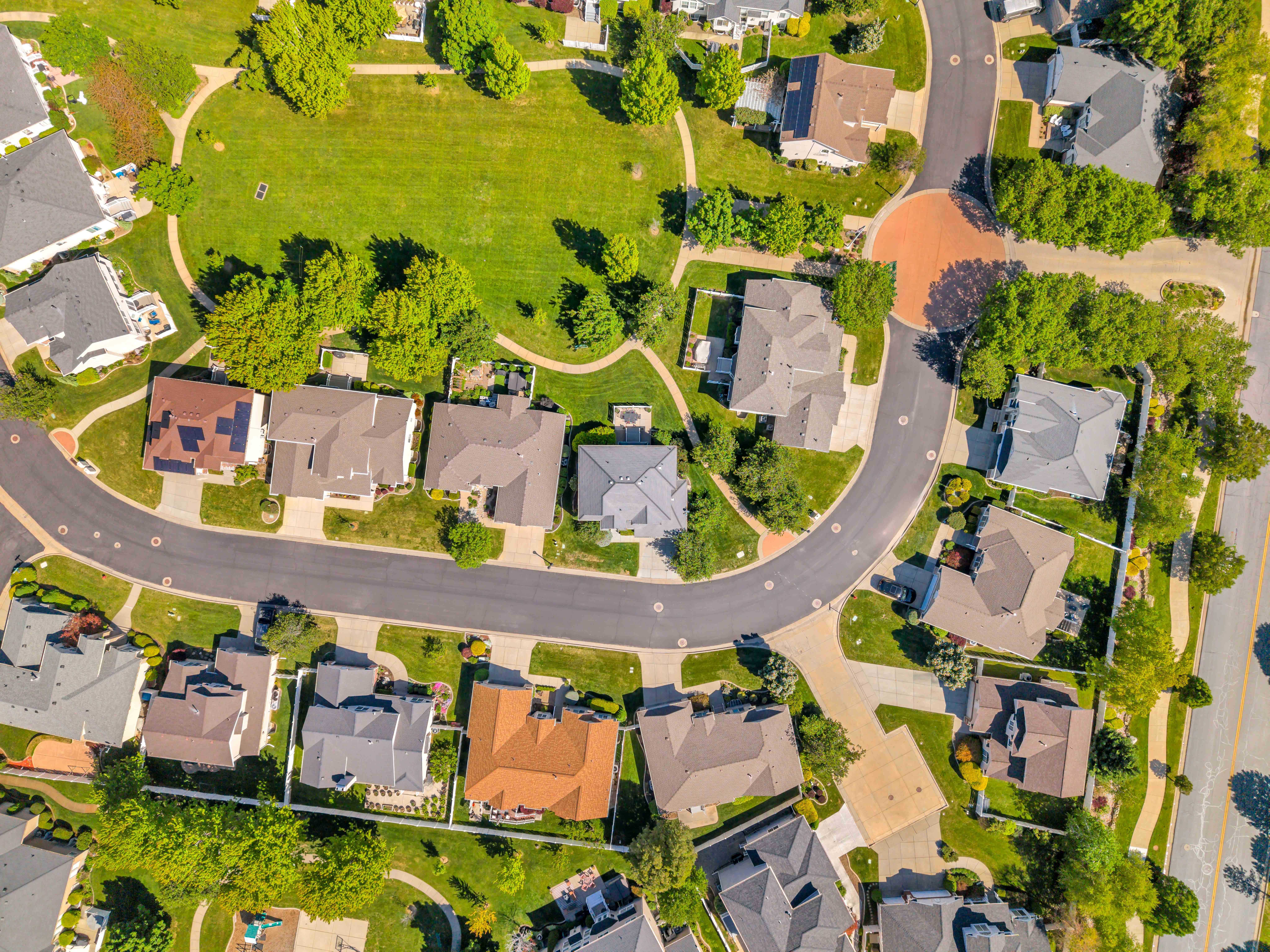 Residential neighborhood with curvilinear streets, cul-de-sacs, and an integrated green space
