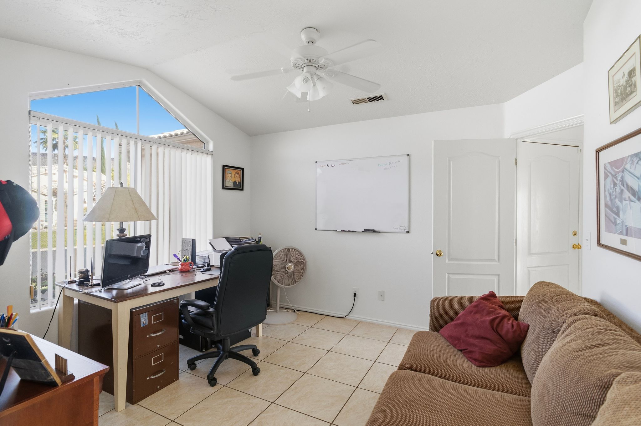 Room featuring vaulted ceilings and ceramic tile flooring