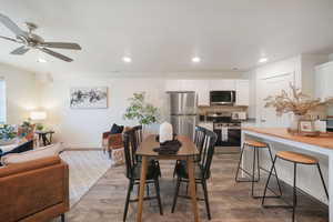 Open-concept living space featuring wood-finish flooring