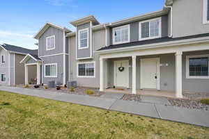 Contemporary multi-unit exterior featuring contrasting siding materials and white trim