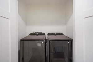 Dedicated laundry closet with white panel doors