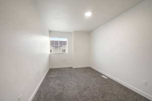 Neutral wall tones with gray carpeting