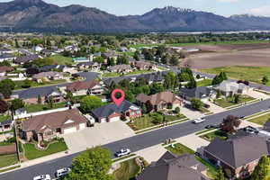 Aerial perspective showcasing a residential neighborhood with mountain scenery