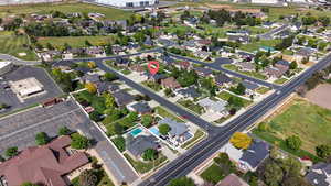 Residential community featuring paved streets, mature landscaping, and varied architectural styles
