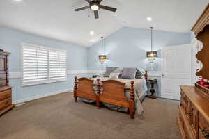Spacious room featuring vaulted ceilings, recessed lighting, and a ceiling fan