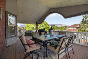 Covered deck featuring composite wood-finish flooring