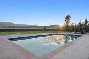 Rectangular in-ground swimming pool with a blue tiled edge