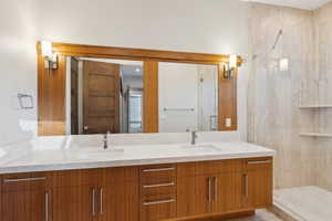 Dual vanity with a light-toned countertop and integrated sinks