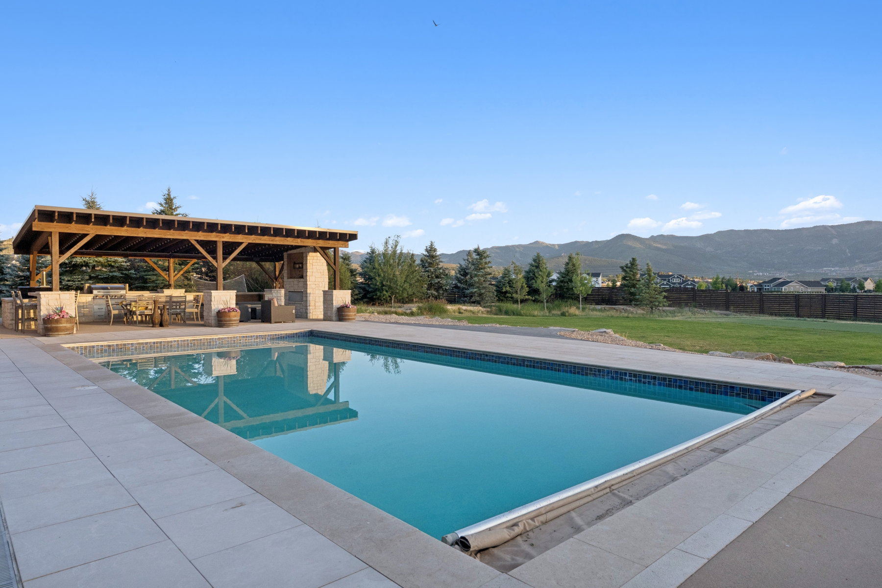 Rectangular inground pool with surrounding hardscaping