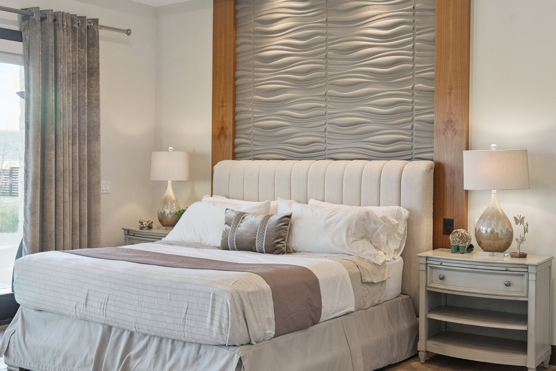 Accent wall with textured paneling and wood-finish trim