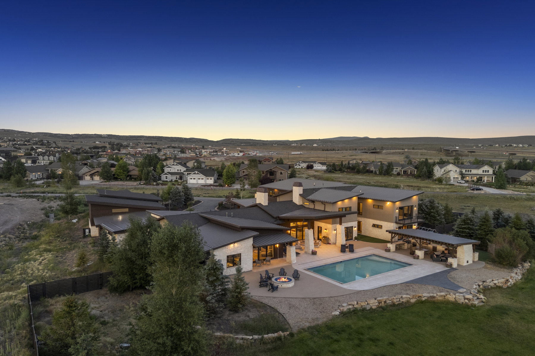 Contemporary architectural design featuring a spacious outdoor patio with an integrated swimming pool