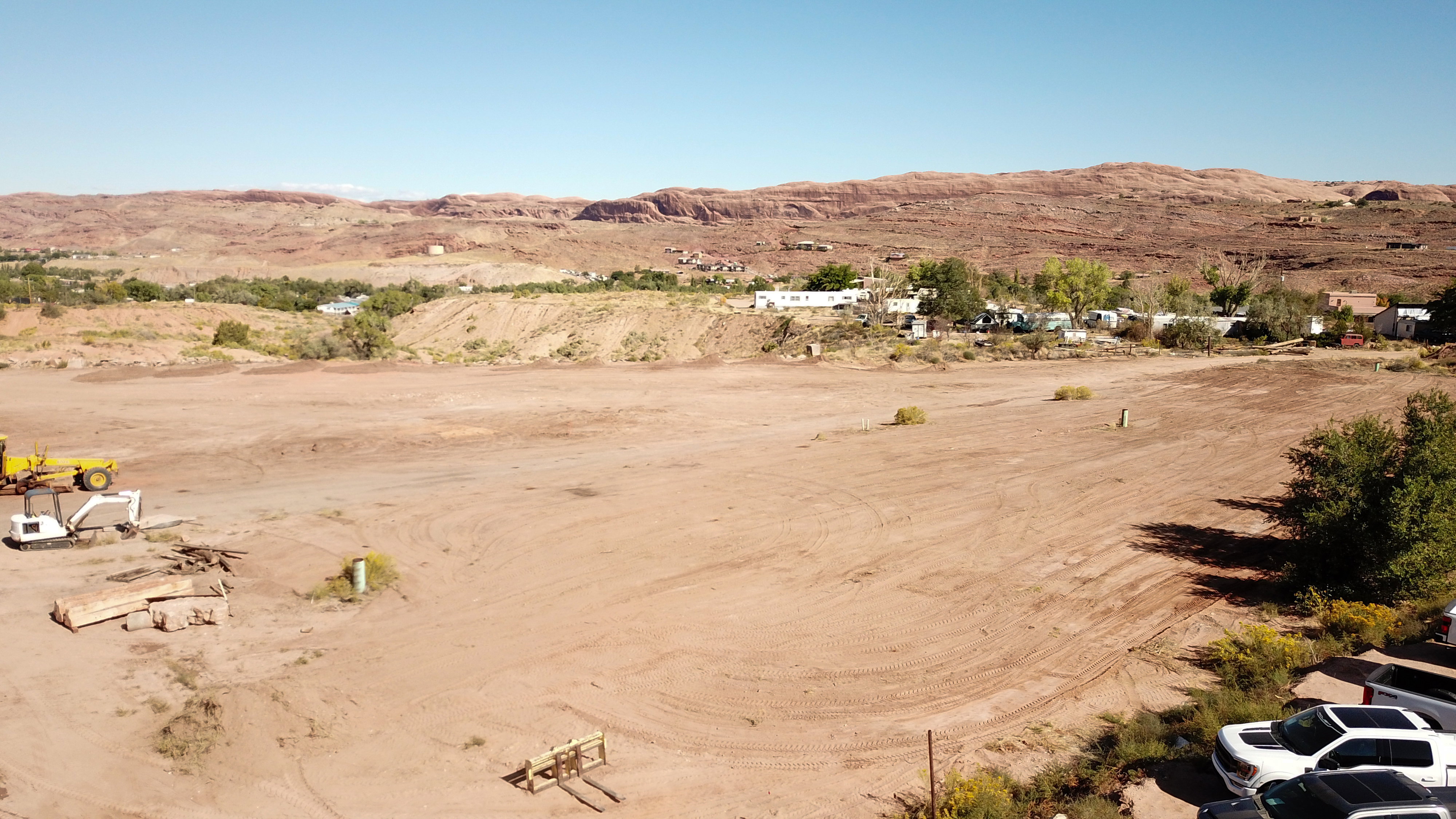 Expansive cleared land parcel offering desert landscape and distant elevated terrain