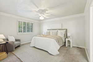 Bedroom featuring neutral carpeting, crown molding, a ceiling fan with integrated lighting, window with plantation shutters, and a wall-mounted headboard