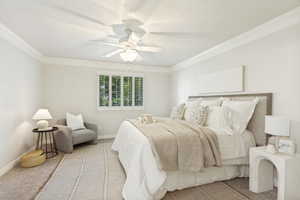 Room featuring crown molding, a ceiling fan with integrated lighting, window shutters, and plush carpet flooring