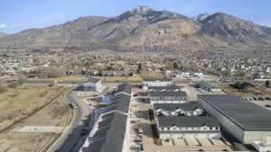 Newly constructed multi-story townhomes with light-colored siding and dark shingle roofs