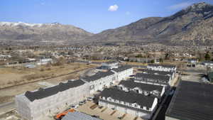 Townhome community with mountain scenery, multiple buildings, and varied rooflines