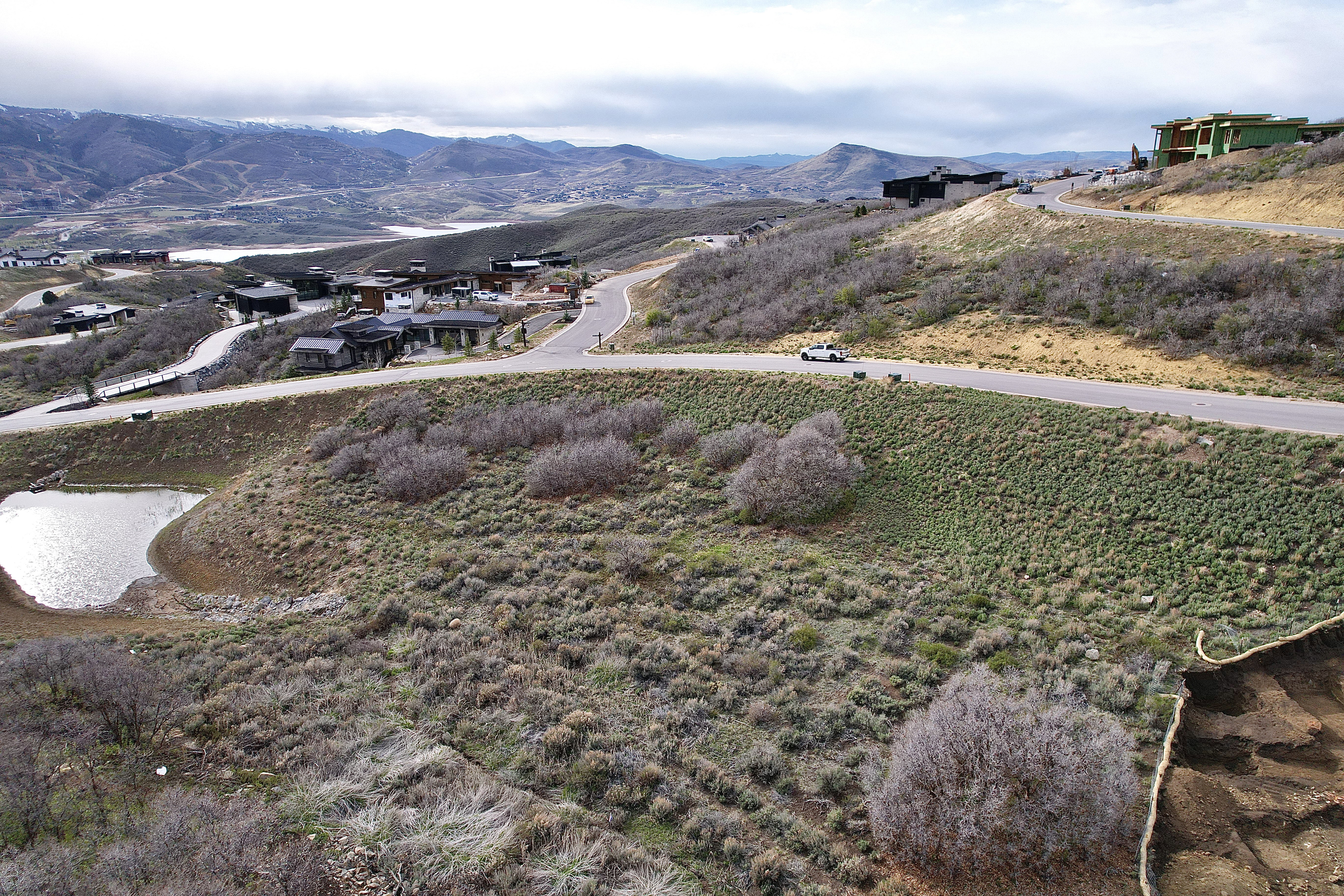 Expansive undeveloped land featuring a natural pond