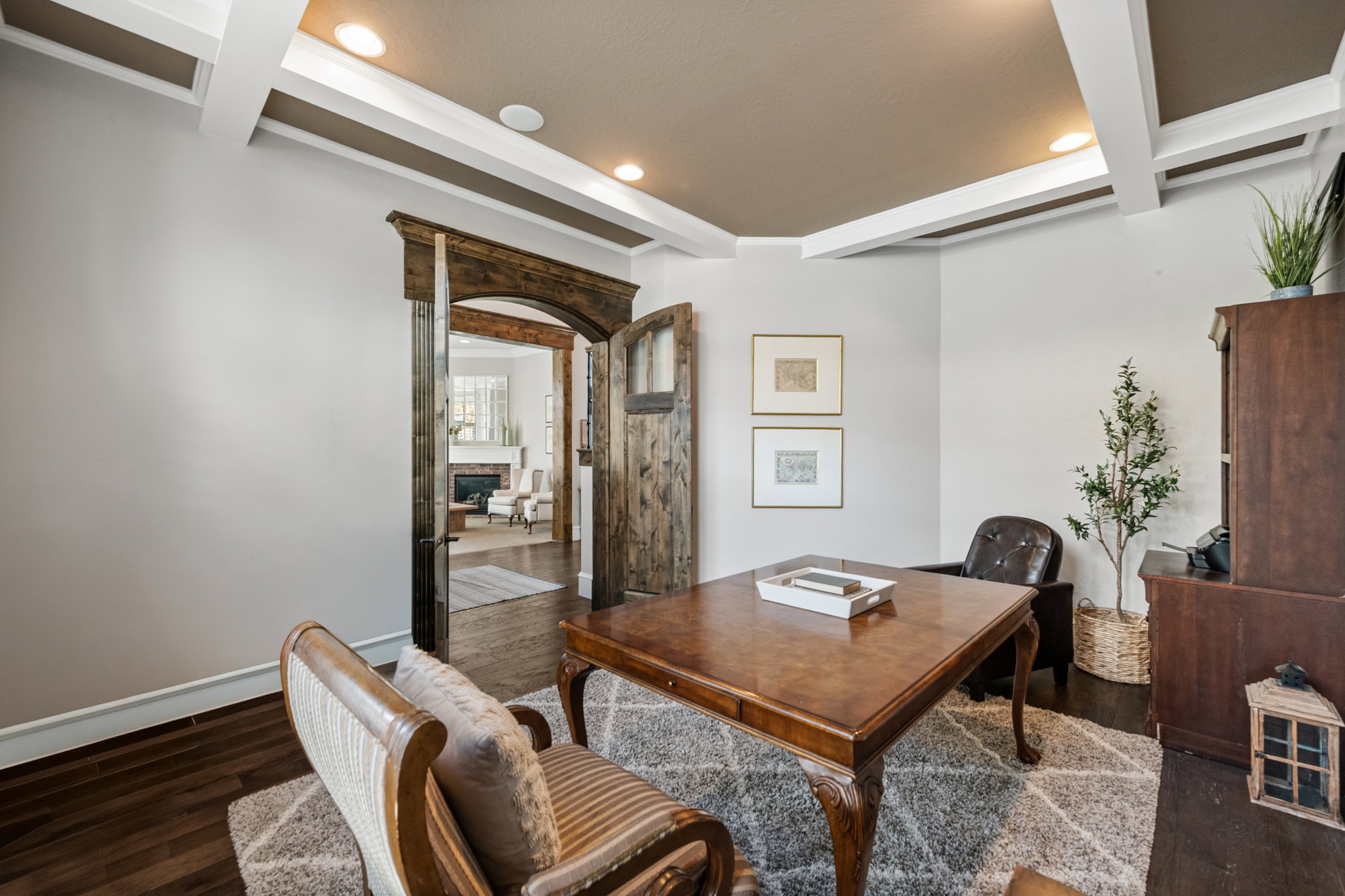 Room with coffered ceiling featuring recessed lighting and wood-finish flooring