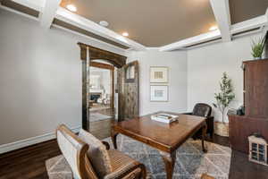 Room with coffered ceiling featuring recessed lighting and wood-finish flooring