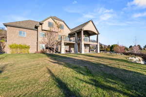 Expansive green lawn bordering a multi-level home featuring brick and siding facades