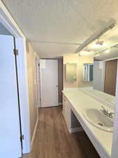Spacious bathroom vanity with an integrated sink, polished chrome faucet, and ample counter space